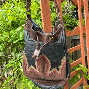 Black brown embossed leather bag. Tribal theme